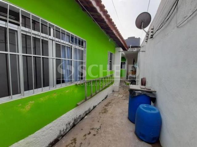 Terreno em Local Comercial com Casa Térrea