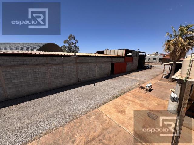 TERRENO EN VENTA EN AV. ZARAGOZA CON BODEGAS