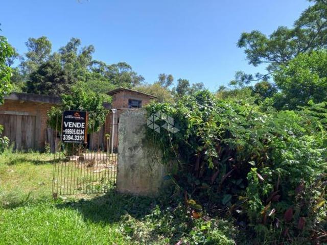 Terreno tipo sítio, medindo 20,00 x 63,20, com casa ampla em construção para venda na Restinga