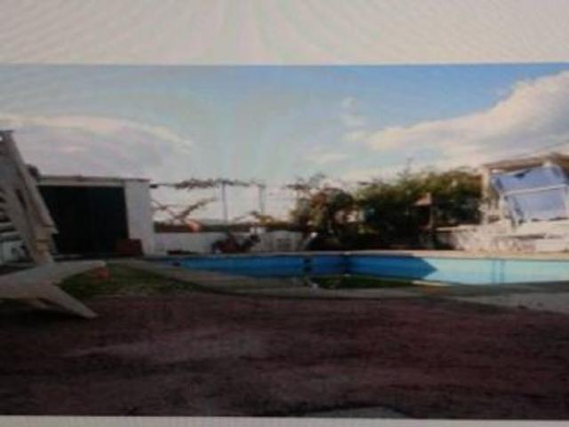 TERRENO URBANO CON CASA DE MADERA Y CASA DE CEMENTO