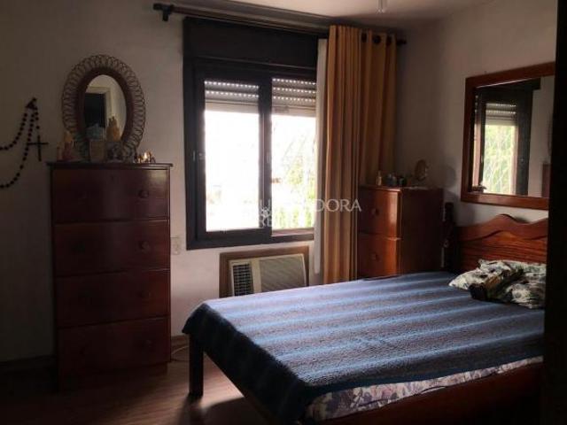Terreno 10x35 com casa no Bairro Cristo Redentor