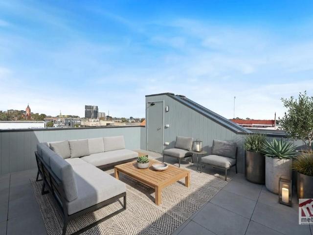 THOUGHTFULLY DESIGNED WITH PRIVATE ROOFTOP TERRACE!