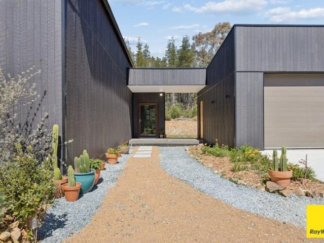 The Black Offgrid House on the Hill