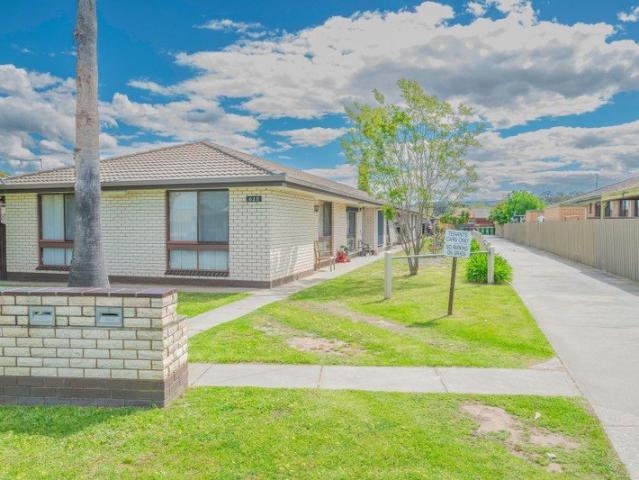 THE BRIEF: Stylish Low Maintenance Unit with High Yield Opportunity!
