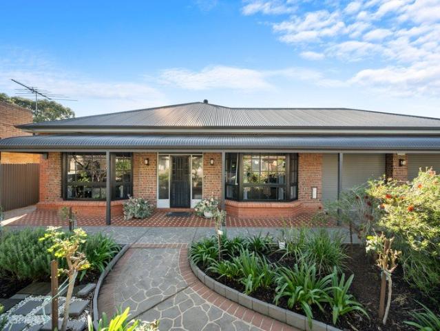 The Epitome of Solid Brick Craftsmanship & Sprawling Family Living!