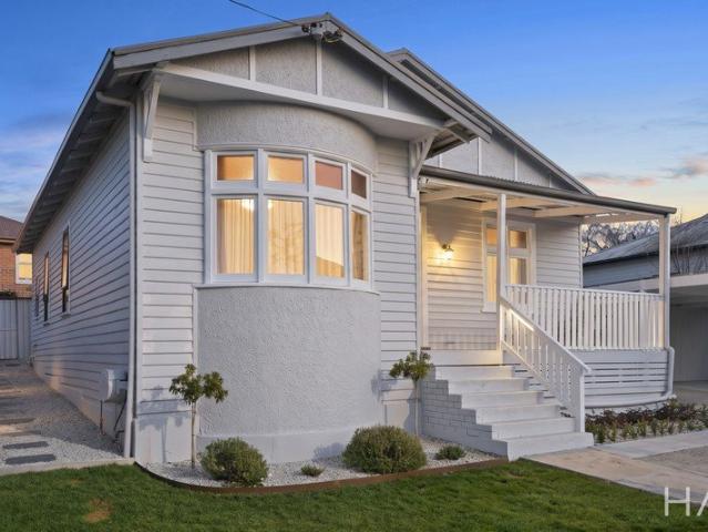 The Home Behind the White Picket Fence!