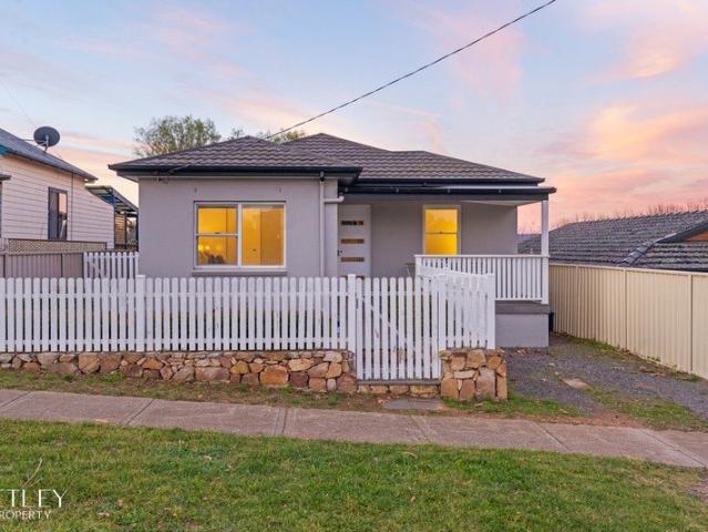 The Home Behind the White Picket Fence