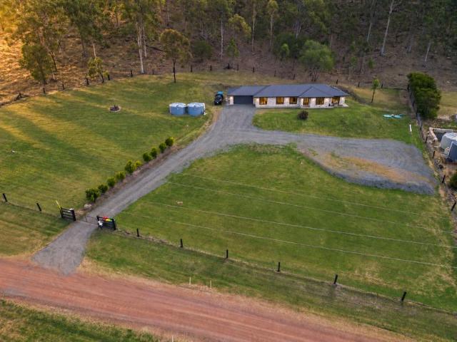 THE ULTIMATE ACREAGE UPGRADE 1.4 Acres, 3 Living Zones, 4 Bedrooms!