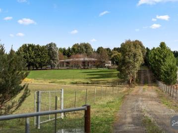 The ultimate multi gen estate: 2 homes, nearly 5 acres, and a private indoor pool complex
