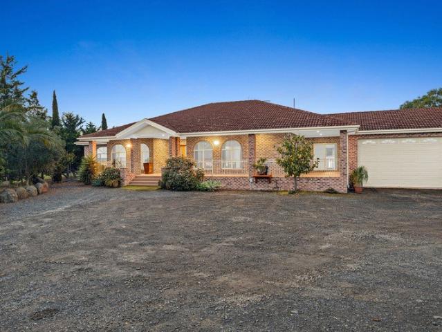 The Ultimate Multigenerational Estate: Grand Dual Living & Unmatched Utility on One Acre