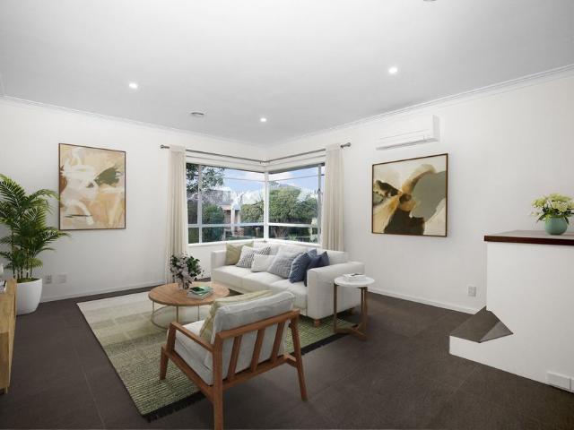Renovated Three Bedroom Townhouse with Double Garage & Private Courtyard