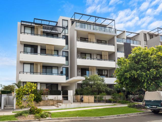 THIRD FLOOR UNIT WITH FULL LENGTH BALCONY!