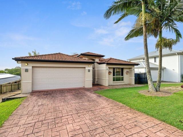 This contemporary family home, within the Mansfield State High Catchment area, has polished timber floors with a formal living area, stylishly filled