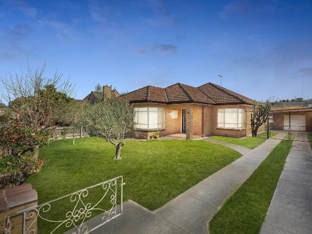 This perfectly preserved solid brick home of immaculate charm