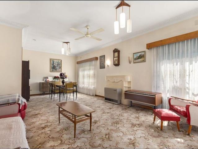This perfectly preserved solid brick home of immaculate charm