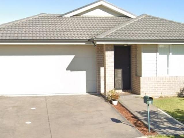 This spacious and contemporary family home features light filled interiors designed to maximize natural light and generous, free flowing living spaces. Perfectly situated, it is just a short stroll to Jordan Springs Shopping Centre