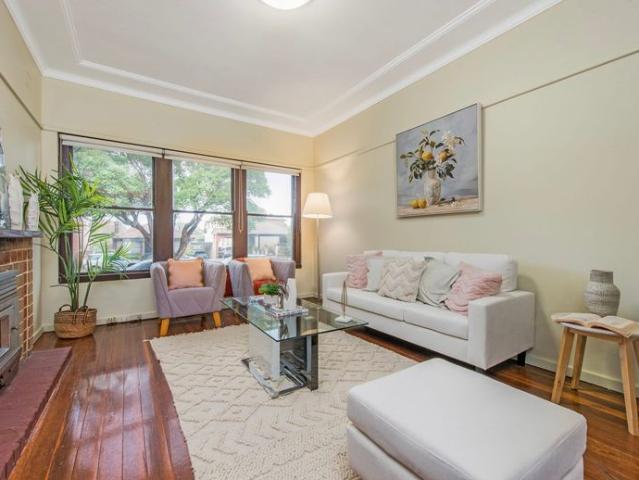 Three bedroom brick home with backyard and garage
