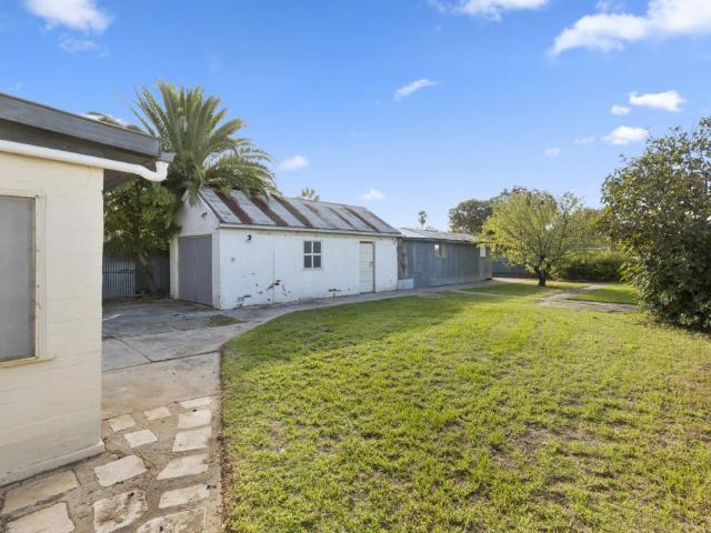 Three Bedroom Family Home with Huge Yard & Workshop