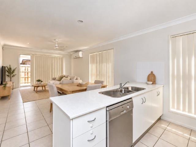 Three bedroom home with covered patio and garden shed