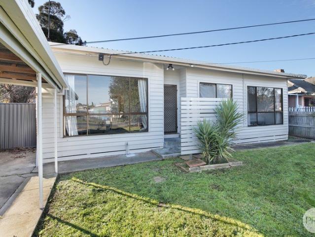 THREE BEDROOM HOME WITH LARGE REAR YARD