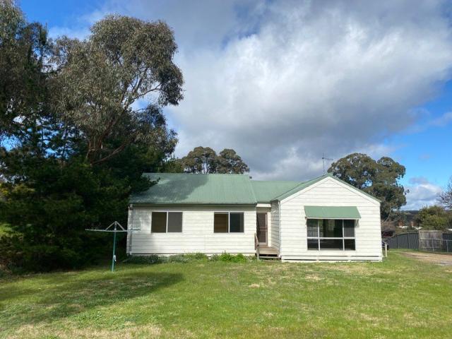 APPLICATION PENDING* Three bedroom low maintenance home, close to town