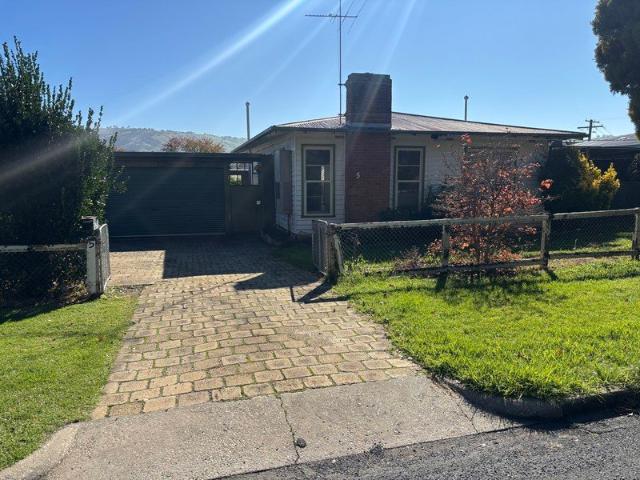 Three bedroom weatherboard home, open plan living, double lock up carport, large enclosed back yard