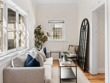 Three bedrooms, a sunroom, & a backyard worth coming home to
