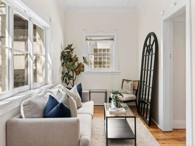 Three bedrooms, a sunroom, & a backyard worth coming home to