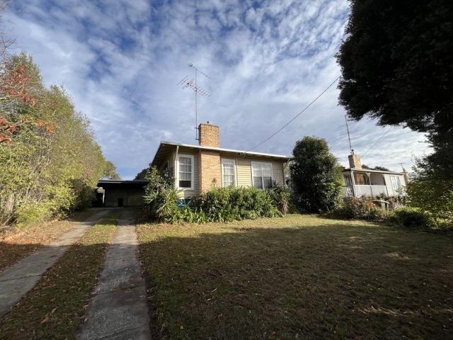 Three bedrooms, one fantastic shed!