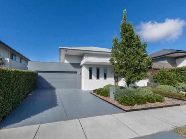 Three living spaces, established gardens and room for family life