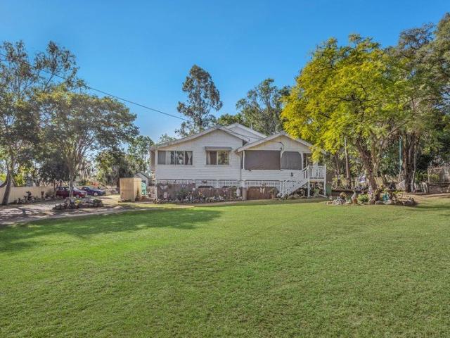 Timeless 1920s Character Home with High Ceilings & Walk to Town Convenience