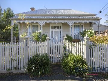 Timeless Victorian Charm in a Blue Chip Tree Lined Setting