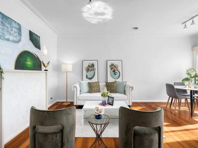 Timeless Brick Home in a Tranquil Tree Lined Street