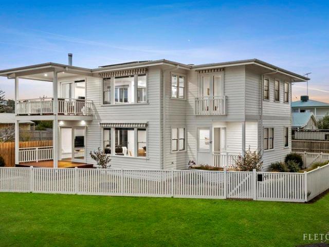 Timeless Coastal Elegance in a Premier Waterfront Setting