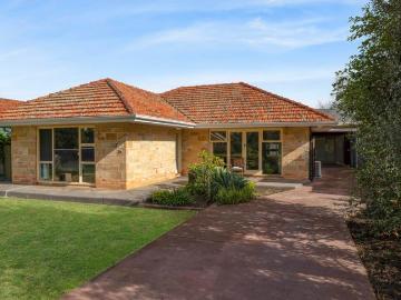 Timeless Mid Century Charm in a Prime Family Location