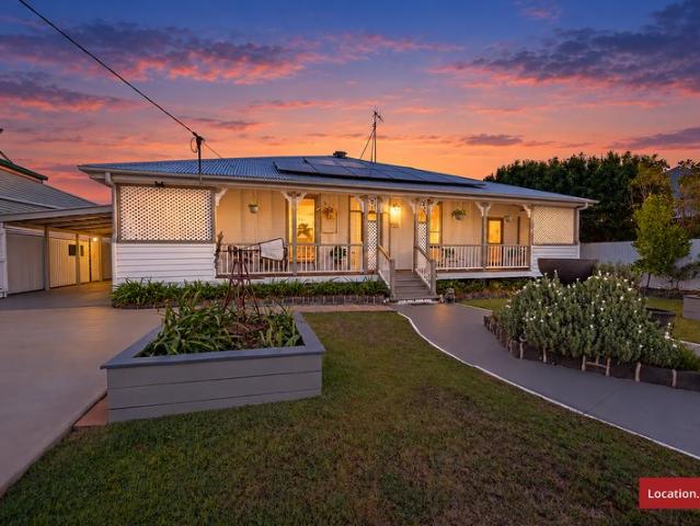 TIMELESS QUEENSLANDER CHARM ON 1,012M² WITH SHEDS & SO MUCH MORE!