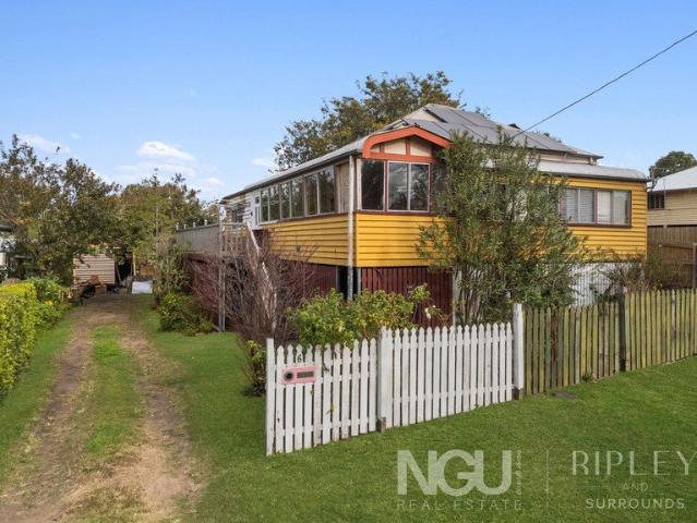 TIMELESS QUEENSLANDER CHARM ON A RARE 1,012M2 ALLOTMENT