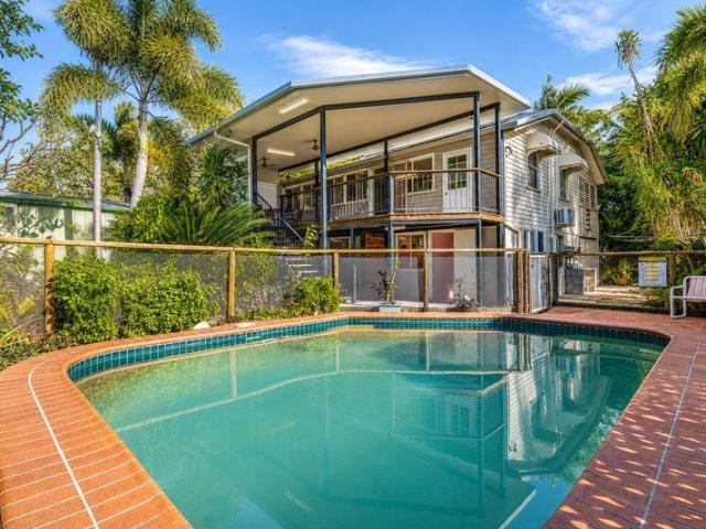 Timeless Queenslander Charm Set Amongst a Tropical Garden Oasis