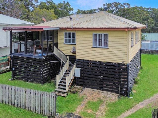 Timeless Queenslander Charm with Water Views.