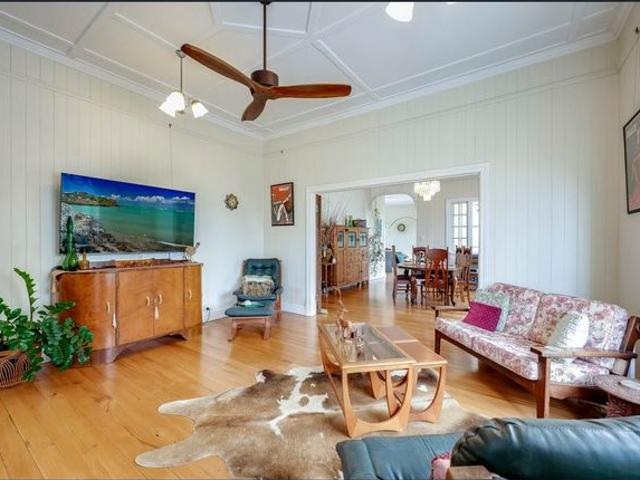 Timeless Queenslander Elegance on 4,100sqm Backing Onto Lagoon