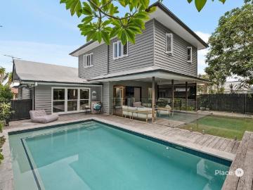Timeless Queenslander Elegance with Elevated City Glimpses