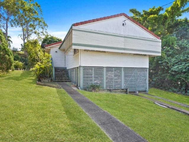 TIDY HOME WITH SPACIOUS YARD IN GREAT LOCATION