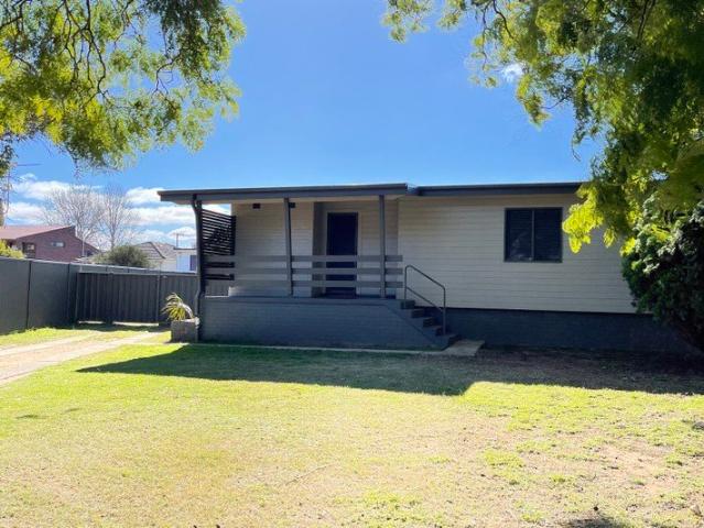 Tidy Three Bedroom Home with Spacious Backyard