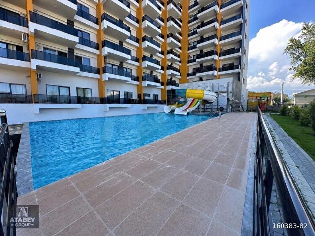 TÖMÜKTE DENİZE 700 METRE FULL EŞYALI AQUAPARKLI HAVUZLU 1+1