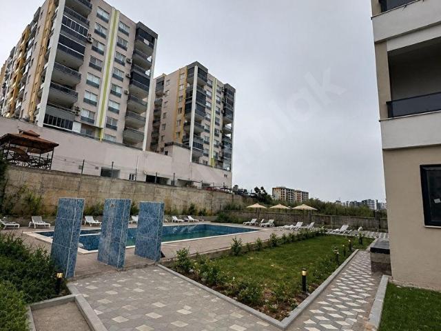 TÖMÜKTE SIFIR 1+1 HAVUZLU SİTE DENİZE YAKIN YATIRIMLIK