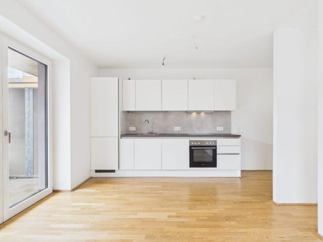 Top 1,5 Zimmer Neubauwohnung mit Balkon im grünen Wildgartenquartier