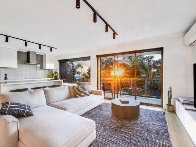 Top Floor Coastal Living with Sweeping Ocean Views