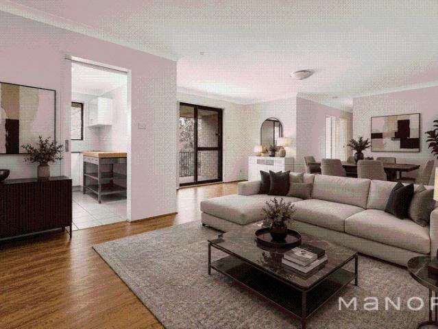Top Floor Apartment with Double Garage in a Prime Location!