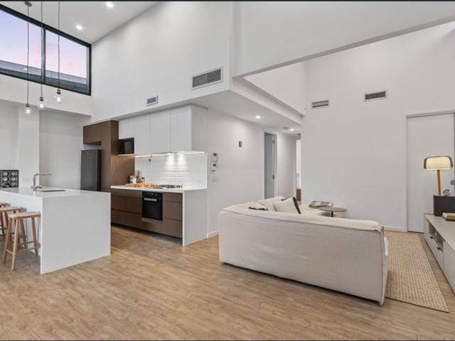 Top Floor Apartment with Expansive Outdoor Living Stunning City Skyline Views. Minutes Walk From James Street