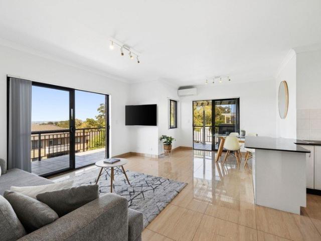 Top Floor Apartment with Expansive Terrace & Sweeping District and Water Views